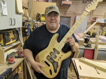 Don posing with guitar